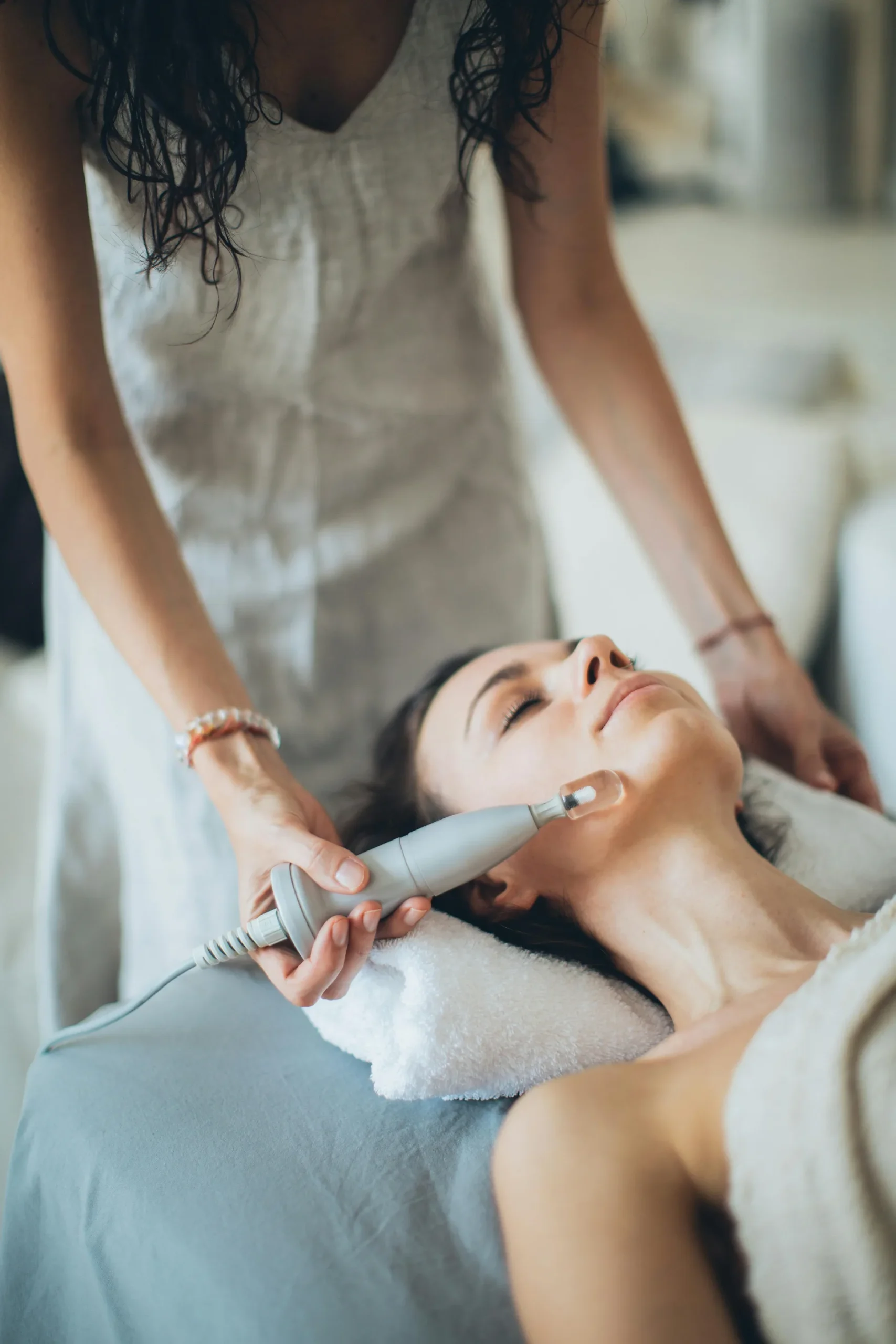 Woman lying down during a spa facial procedure