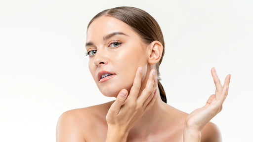 Woman touching face showing skin tightening results from PDO thread lift